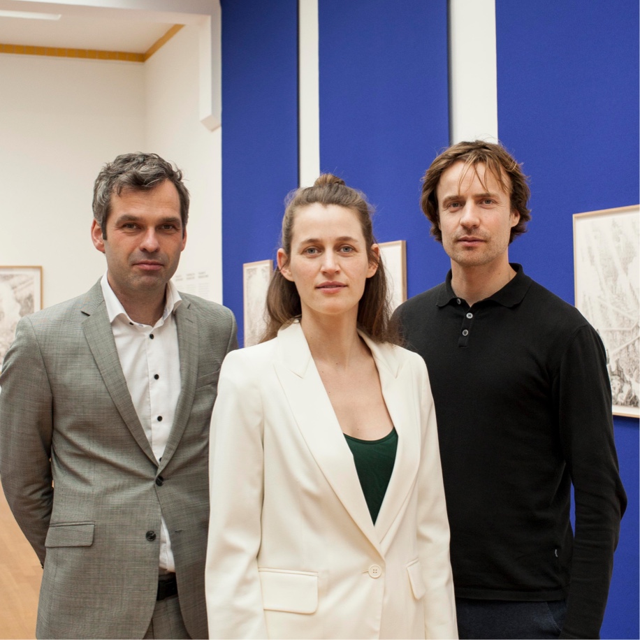 Carlijn Kingma, Thomas Bollen, and Martijn Jeroen van der Linden standing in a gallery at Kunstmuseum Den Haag